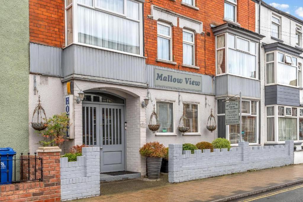 a building with a door on a street at Mallow View Hotel in Cleethorpes