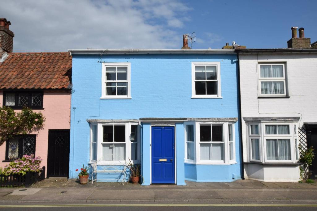 a blue house with white windows and a blue door at Seaflower, Aldeburgh in Aldeburgh