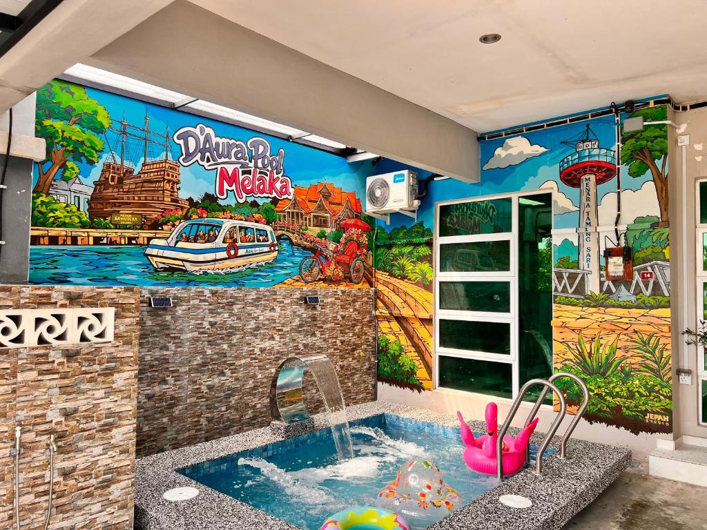 a bathroom with a mural of a water park at Homestay D' Aura Pool Melaka in Ayer Keroh