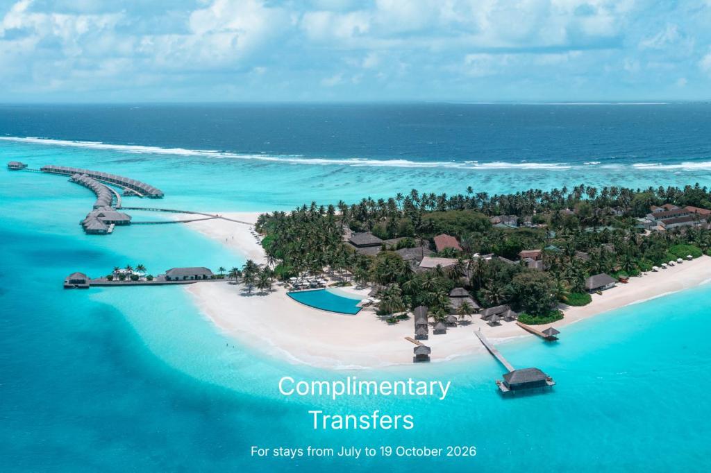 an aerial view of a tropical island in the ocean at Niva Velassaru Maldives in Velassaru Island