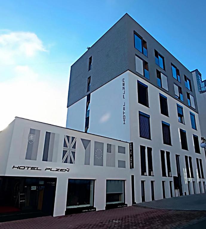 a building with the words hotel flex on it at Hotel Plzeň in Pilsen