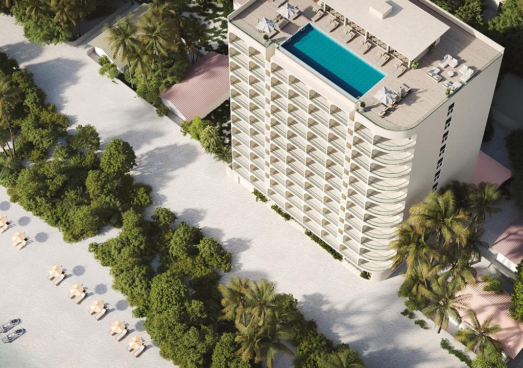 an overhead view of a building with a swimming pool at Kaani Haven Beach in Ukulhas