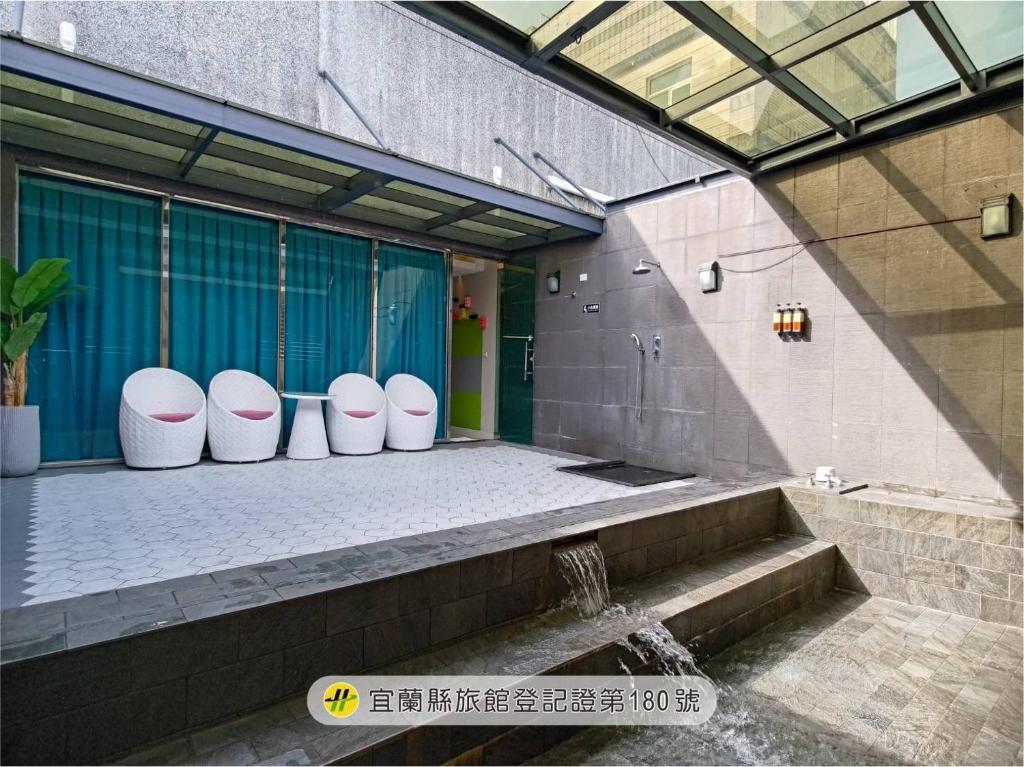 a group of toilets lined up in a building at Ya Nold Hot Spring Hotel in Jiaoxi