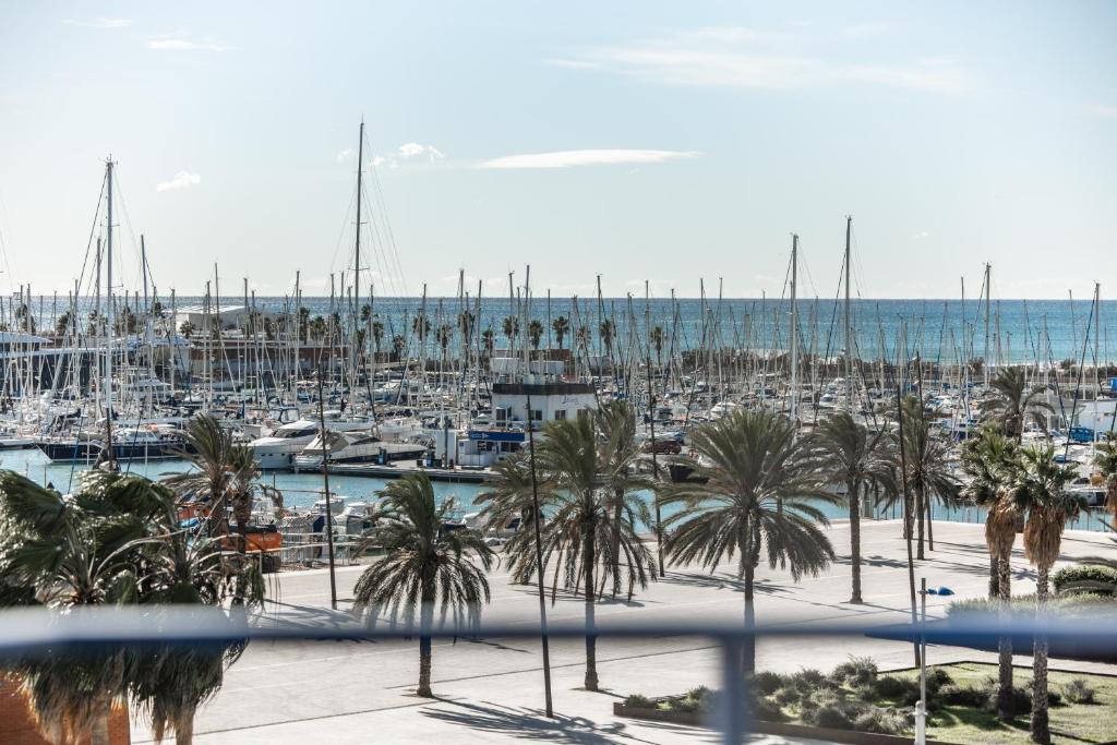 a marina with a bunch of boats in the water at Hotel Boutique La Brisa in Vilanova i la Geltrú