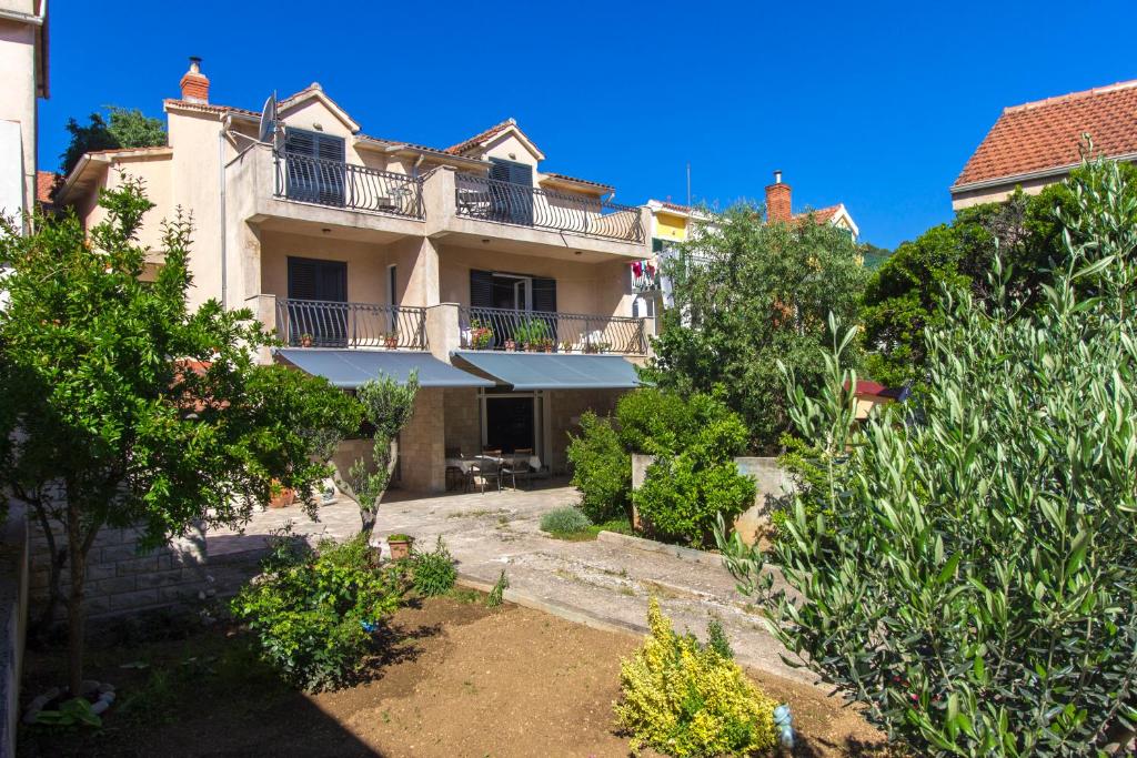 a house with a balcony on top of it at Agata in Šibenik