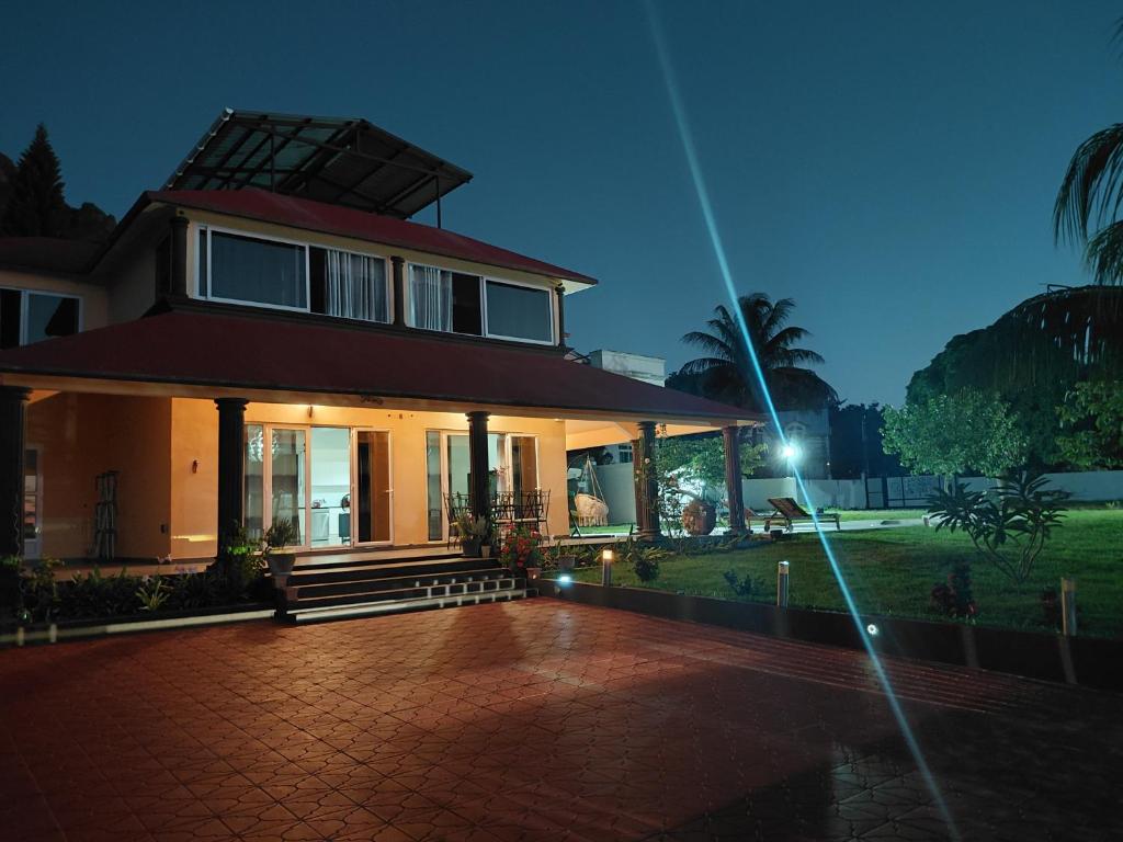 a large house with a porch and a driveway at Blacvine in La Gaulette