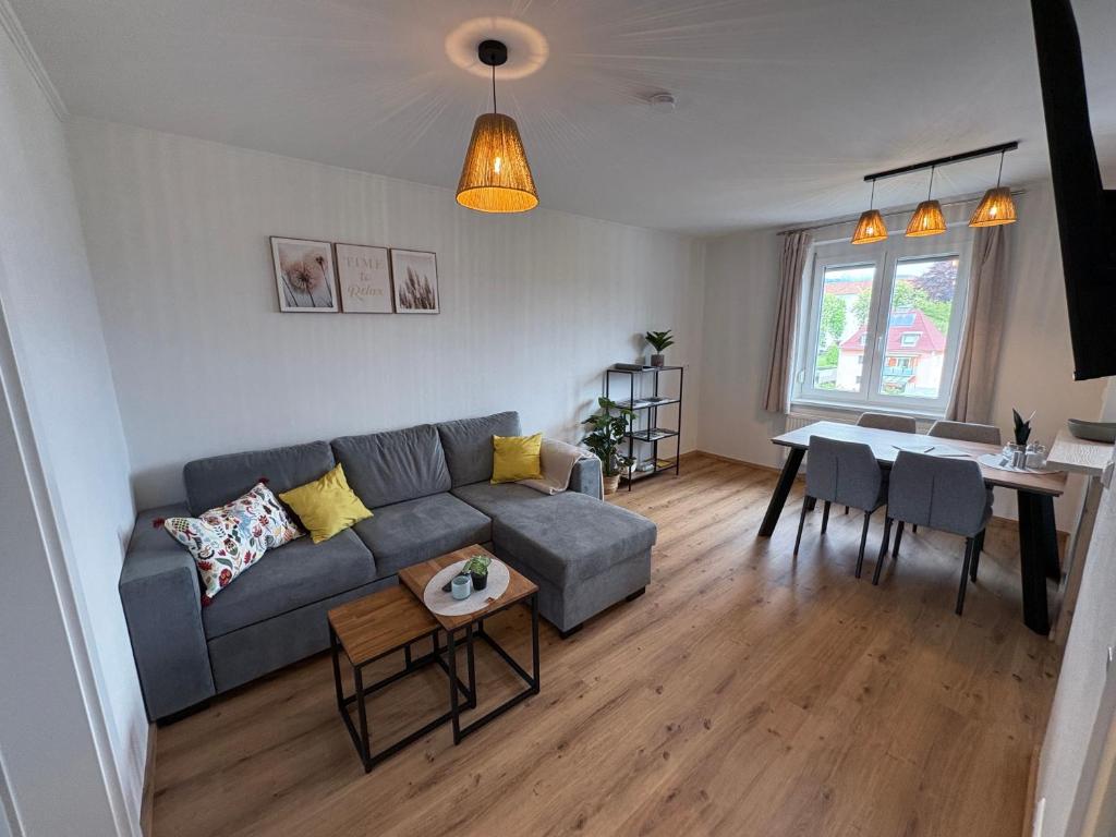 a living room with a couch and a table at Tom s Apartment II in Knittelfeld
