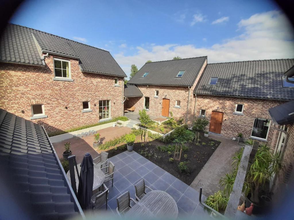 an aerial view of a house with a courtyard at Hof van Sassenbroek in Borgloon
