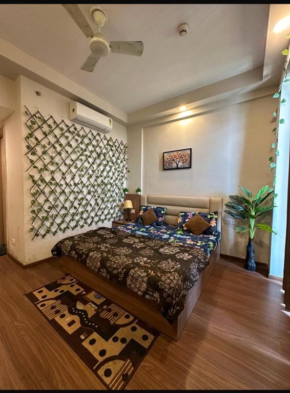 a bedroom with a large bed in a room at TOM n JERY STAYS in Greater Noida