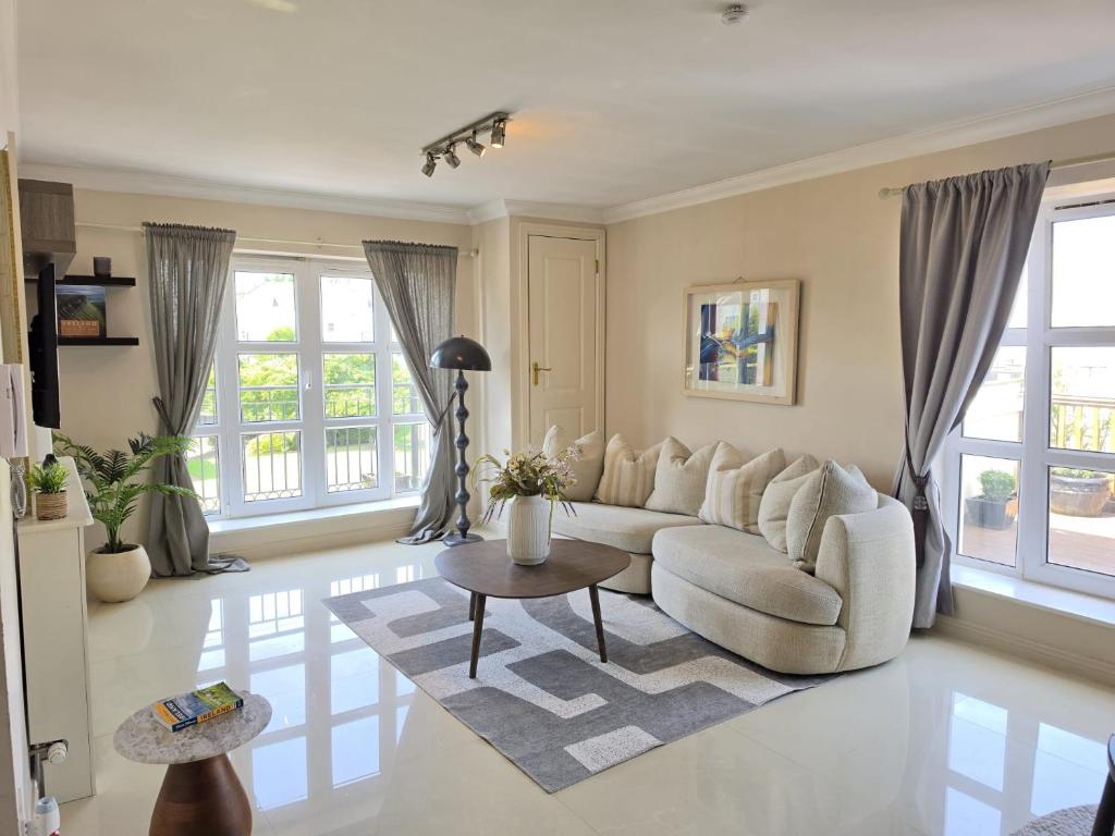 a living room with a couch and a table at 2 Bedr Portmarnock Dublin Suburb in Dublin