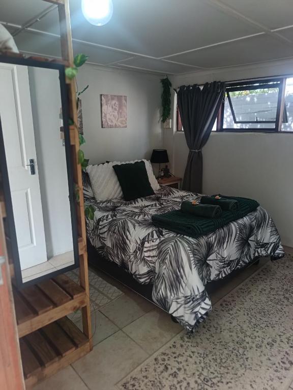 a bedroom with a bed and a couch at 10 on Cane Street in East London