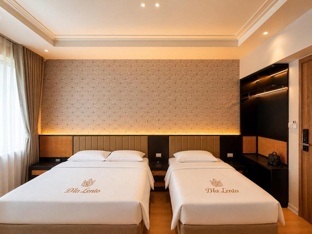 two beds in a hotel room with white sheets at D'la Lento Hotel in Hanoi