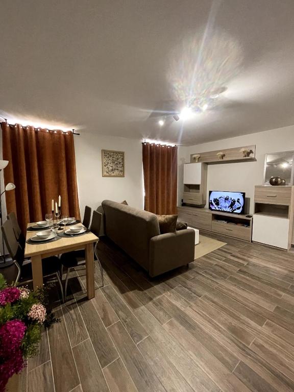 a living room with a couch and a table at Appartement Moutiers Centre in Moutiers
