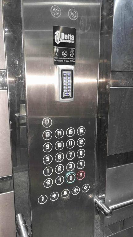 a microwave oven with a remote control on it at اقامة جاد in Oran