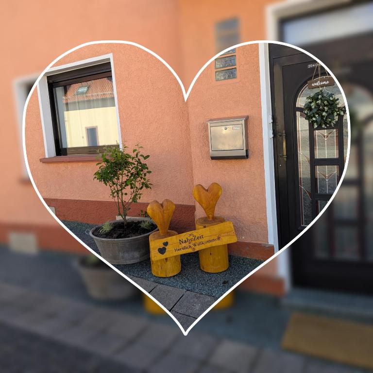 a heart shaped picture of a house with a window at Gute Stube - Ferienhaus NaheZeit Bostalsee in Nohfelden