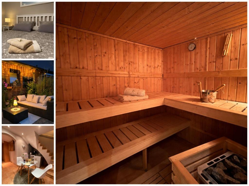 a wooden sauna with a bench in the middle at Kühles Souterrain Apartment mit privater Sauna und Terrasse in Duisburg