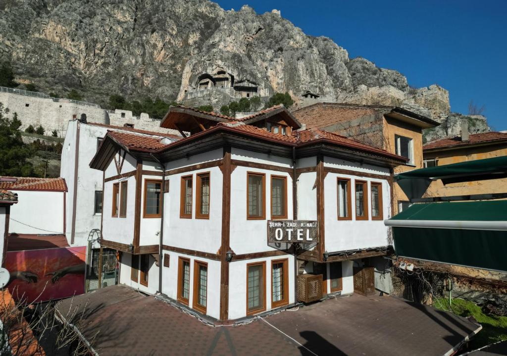 an old building in front of a mountain at Şehrizade Konakları in Amasya