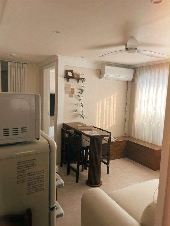 a small room with a table and a dining room at Daejeon Motto stay in Daejeon