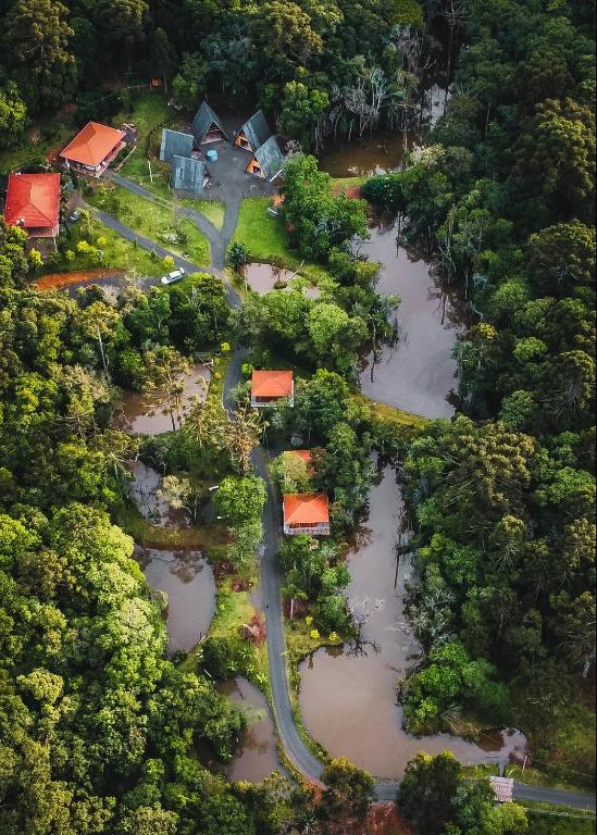 an aerial view of a flooded yard with houses at Fox pousada das águas in Prudentópolis