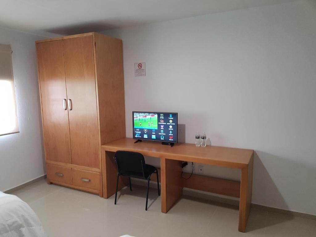 TV a/nebo společenská místnost v ubytování Casa RyS Hotel