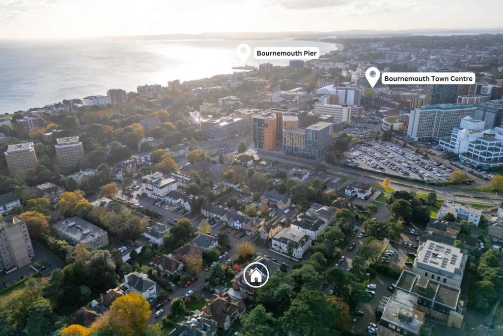 an aerial view of a city with buildings and the water at Cransley in Bournemouth