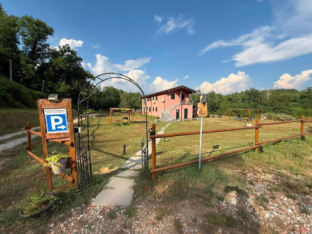 a gate with a parking sign in front of a house at Dalla Gina e Paolino B&B in Aulla
