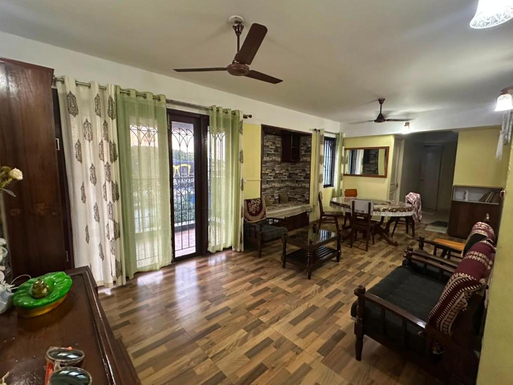 a living room with a couch and a table at ChriSeph in Kottayam