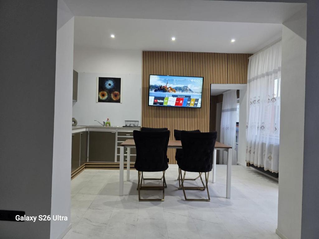 a kitchen and dining room with a table and chairs at Fleurus House in Fleurus