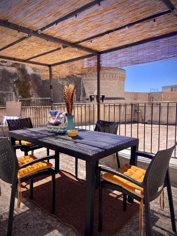 a blue table and chairs on a patio at Le Dimore al Castello in Massafra