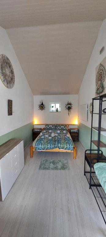 a bedroom with a large bed in a attic at Carma de Madeira Lodge in Penela