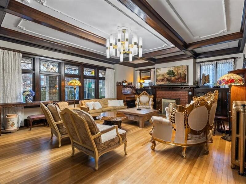 a living room filled with furniture and a chandelier at Stonehurst Estate Sleep 16 in Chilliwack