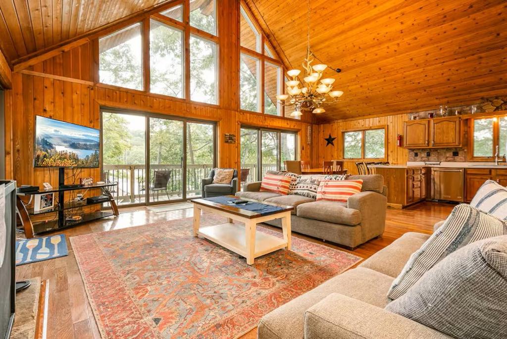 a living room with a couch and a table at Lake Bear Lair in McHenry