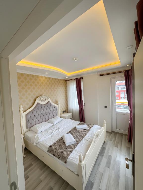 a bedroom with a white bed in a room at Air Otel in Trabzon