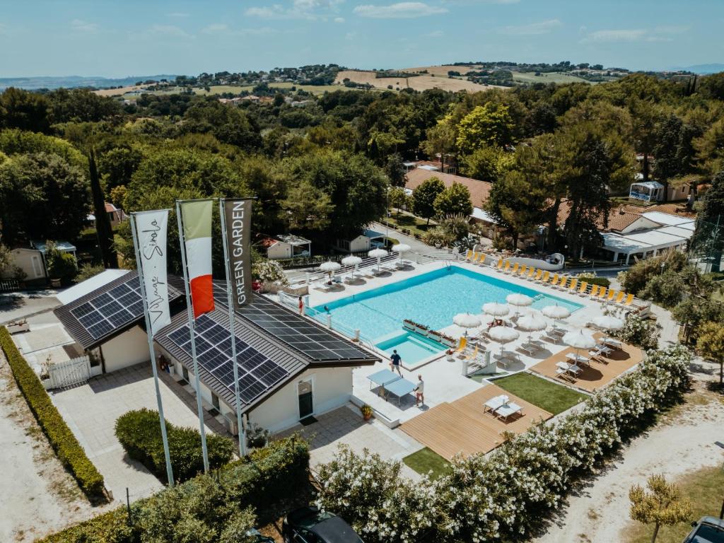 an aerial view of a resort with a swimming pool at Green Garden Village con piscina, spiaggia riservata e parcheggio in Sirolo