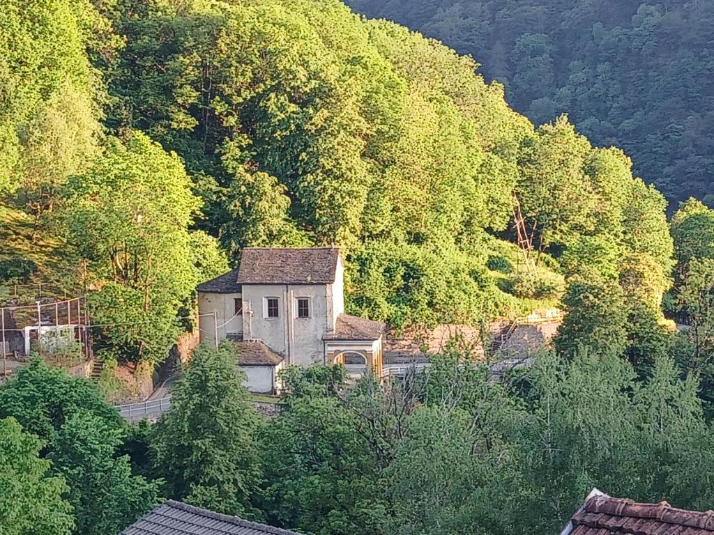 an old house on the side of a mountain at casa della marsiglia in Curiglia