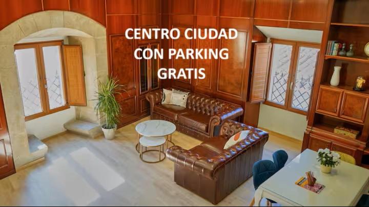 a rendering of a living room with couches and a table at Dùplex Argollas Grand Suite Centro Parking gratis in Plasencia