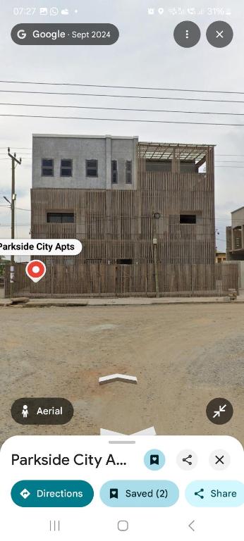 a screenshot of a cell phone of a building at Parkside City Apts in Accra