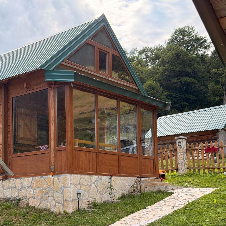 a screened in porch on a house at Naš raj in Berane