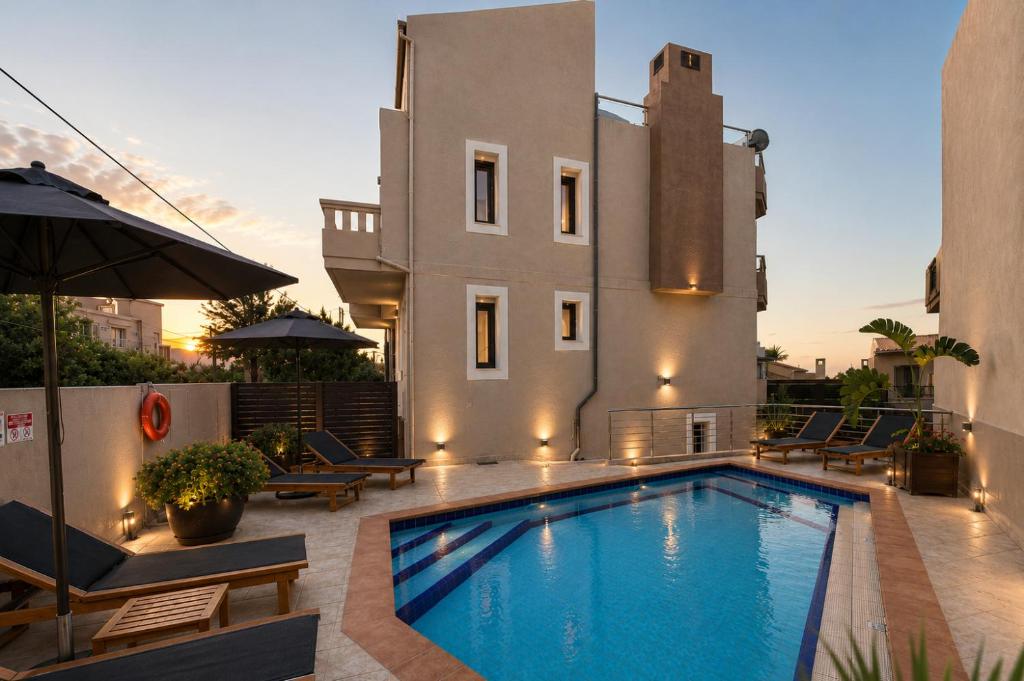 a swimming pool in front of a building at Endless View Villa with Private Pool & BBQ in Daratso