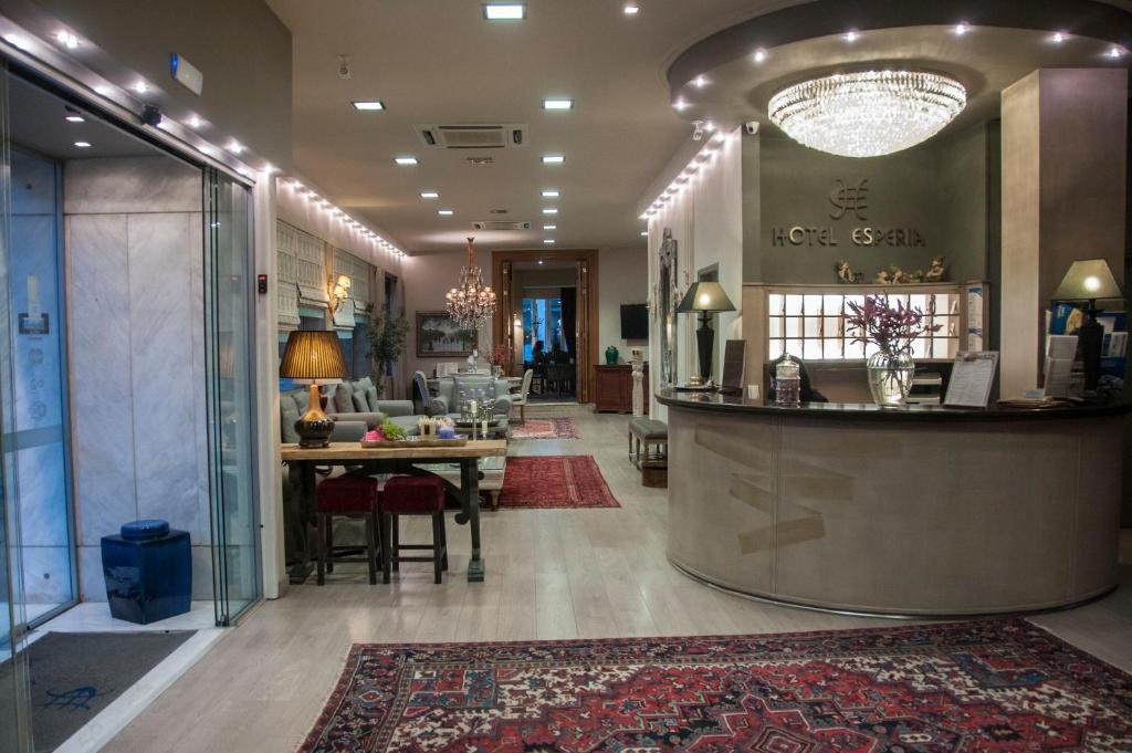 a lobby of a hotel with a reception counter at Esperia Boutique Hotel in Agrinio