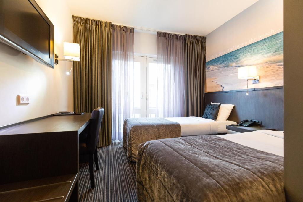 Postel nebo postele na pokoji v ubytování Hotel de Duif Lisse - Keukenhof