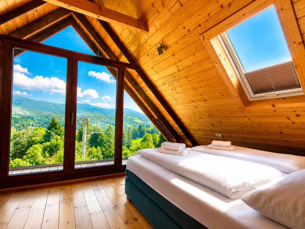 a bedroom with a bed in a room with windows at Domki na Szlaku in Brenna