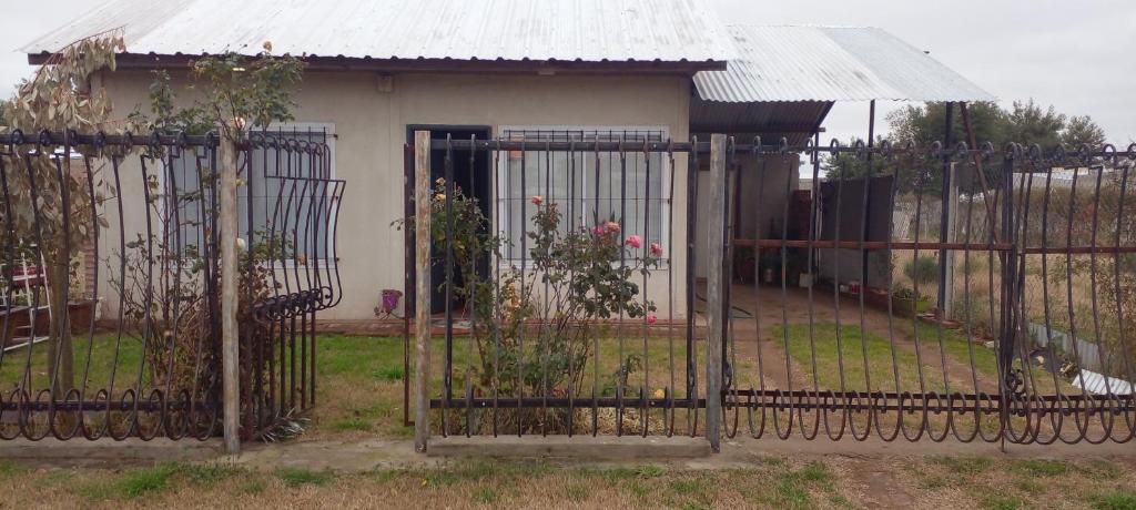 a gate in front of a house at Mi Paraiso in General Pico