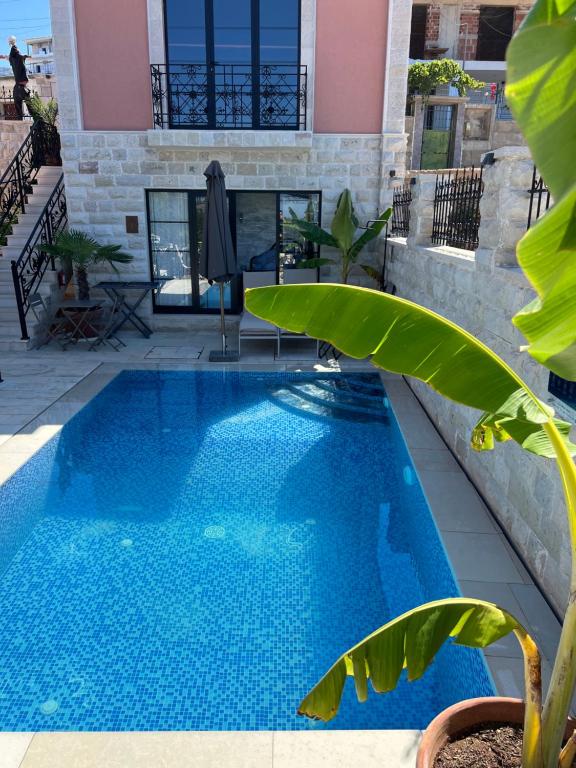 a swimming pool in the middle of a house at The Poet's House in Himare