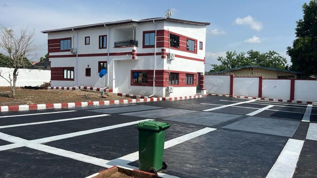 a parking lot in front of a building at M & A Homes Ilorin in Ilorin