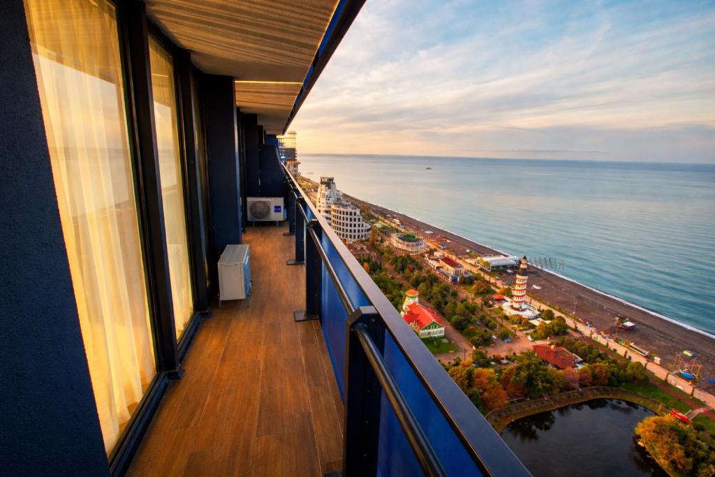 a view of the ocean from the balcony of a cruise ship at Orbi City Sea View Balcony ApartHotel in Batumi