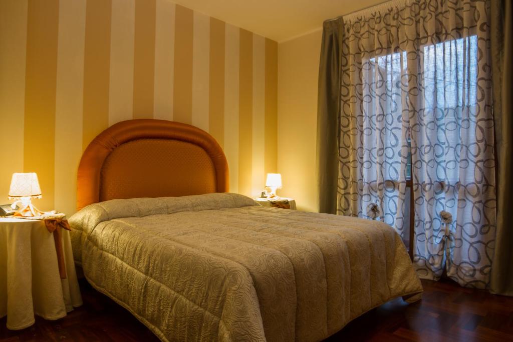 Posteľ alebo postele v izbe v ubytovaní La Gardenia