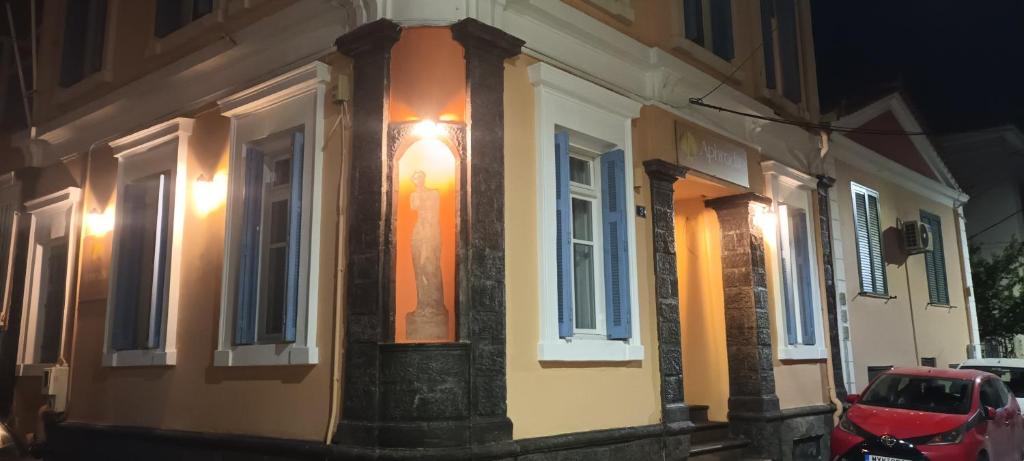 a building with a light on the side of it at Aphrodite luxury rooms in Mytilene