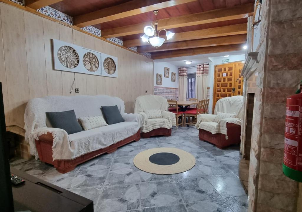 a living room with two couches and a table at Gran Areatxa Home Mountain in Santiago de la Espada
