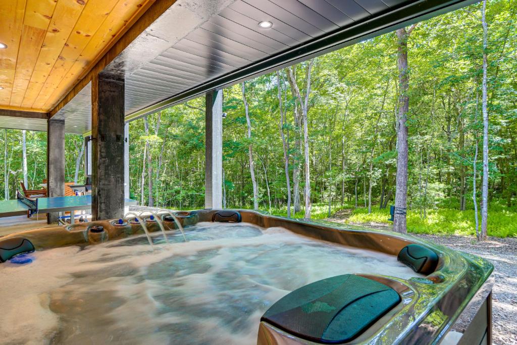 a hot tub in the middle of a room with trees at Blue Ridge, McCaysville, Rafting, Tubing, Secluded in Copperhill